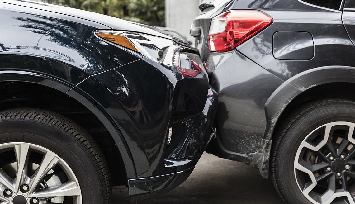 Damaged bumpers from car accident two cars in a fender bender