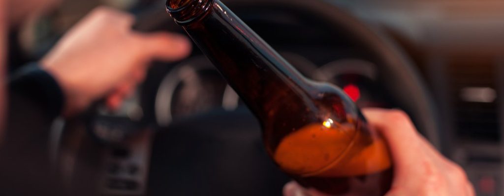 Closeup,Of,Male,Driver,Hands,With,Steering,Wheel,And,Beer Closeup,Of,Male,Driver,Hands,With,Steering,Wheel,And,Beer